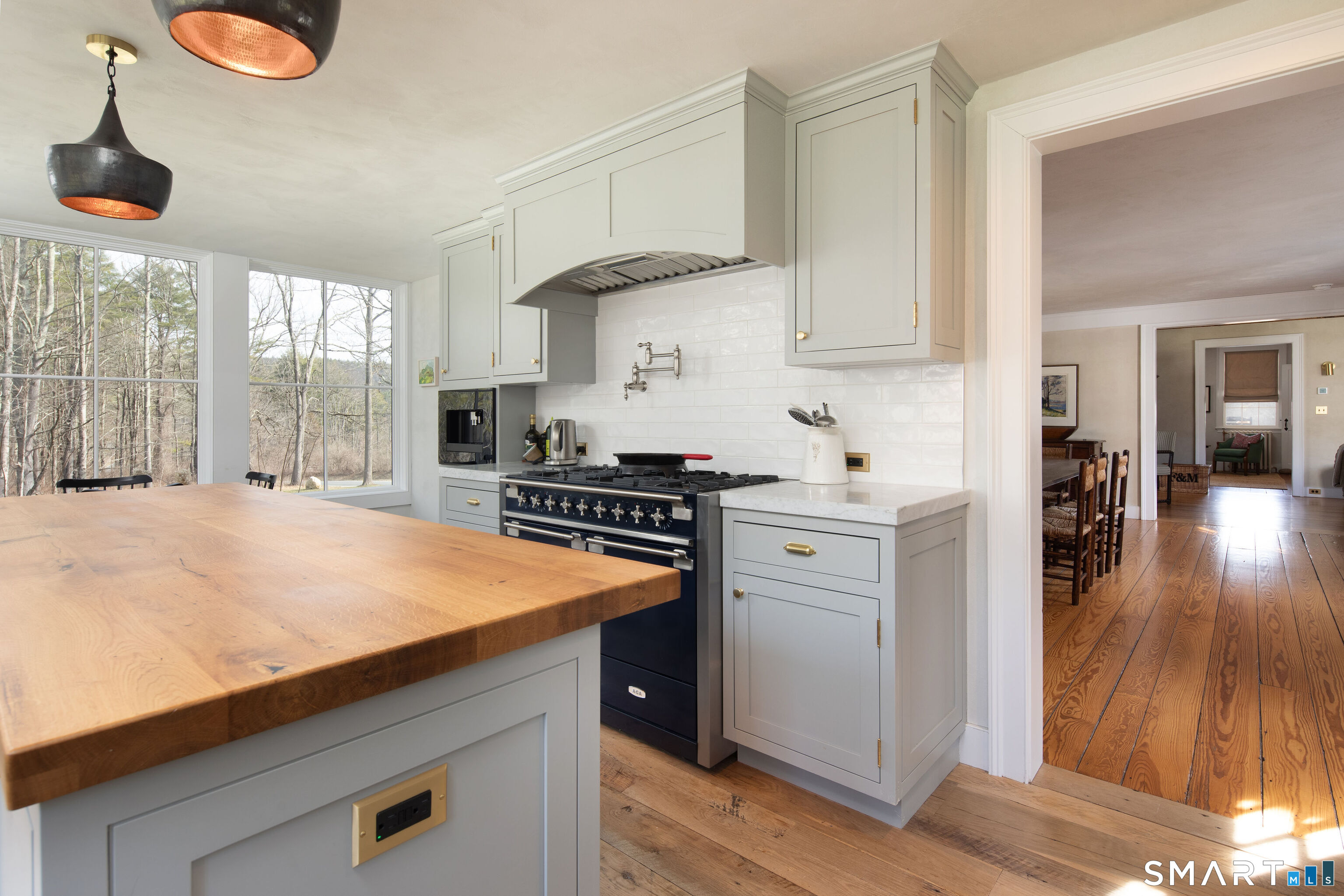 40 Music Mountain Road Canaan, CT 06031 - Photo 6 of 32 a kitchen with a sink a stove cabinets and a wooden floor