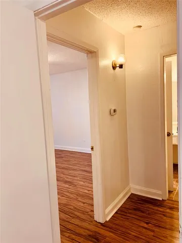 a view of a bathroom from the hallway