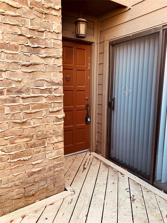 333 Melrose Drive, Unit 25A Richardson, TX 75080 - Photo 2 of 18 a view of wooden door