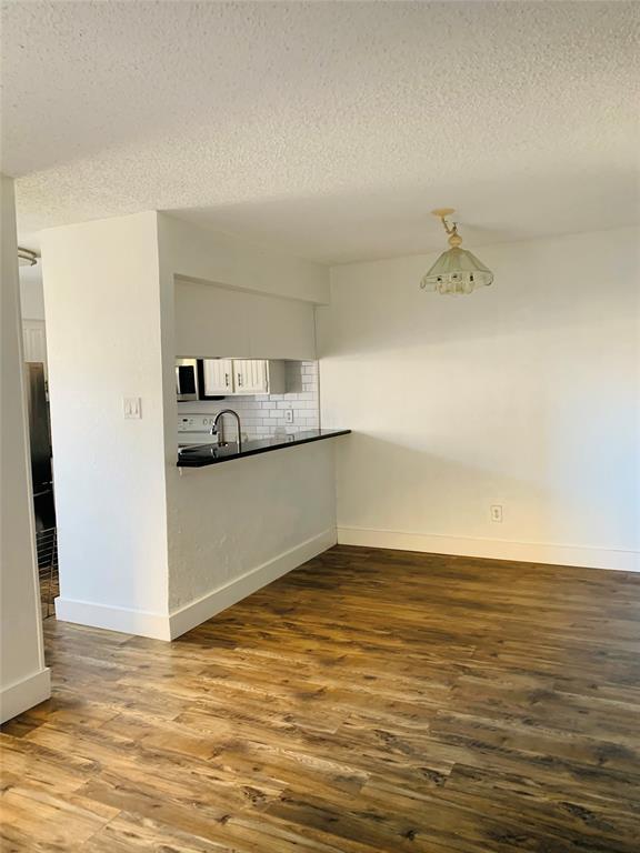 333 Melrose Drive, Unit 25A Richardson, TX 75080 - Photo 4 of 18 a view of kitchen and empty room