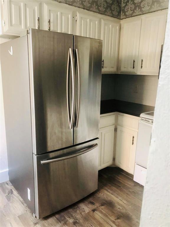 333 Melrose Drive, Unit 25A Richardson, TX 75080 - Photo 5 of 18 a metallic refrigerator freezer sitting in a kitchen