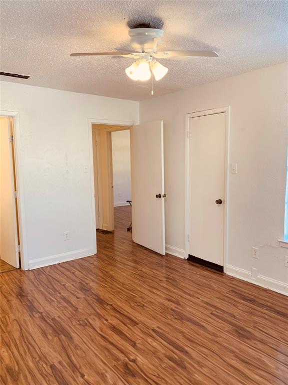 333 Melrose Drive, Unit 25A Richardson, TX 75080 - Photo 10 of 18 a view of an empty room with wooden floor