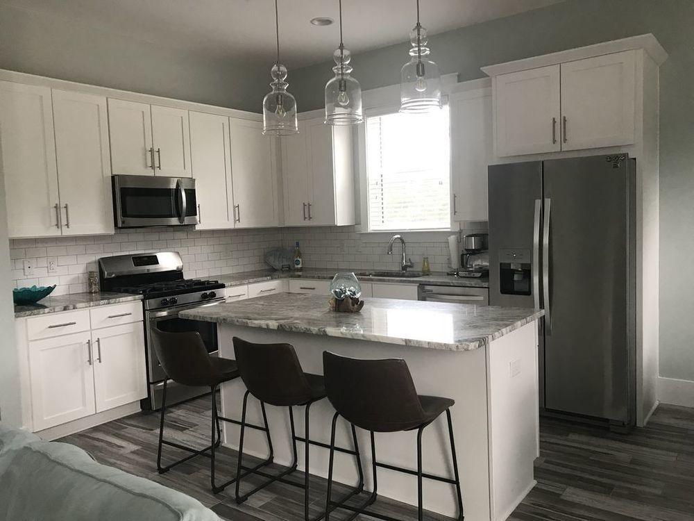 Lot 6 Valdare Ln Inlet Beach Inlet Beach, FL 32461 - Photo 5 of 23 a kitchen with kitchen island granite countertop a sink cabinets a window and stainless steel appliances
