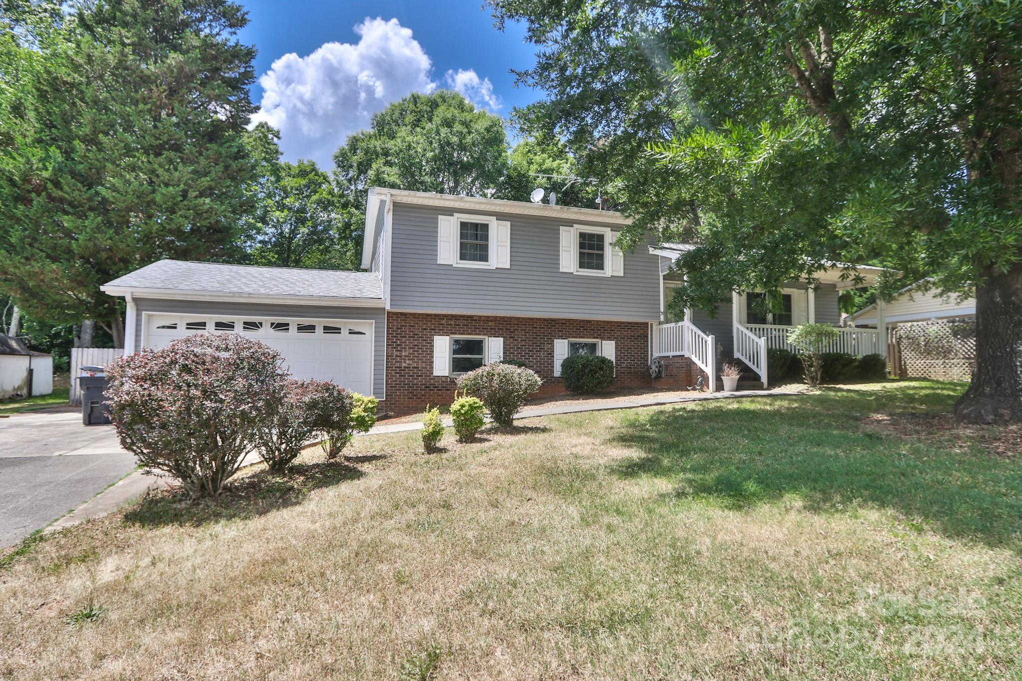 124 Maple Ridge Drive King, NC 27021 - Photo 36 of 40 a front view of house with yard outdoor seating and barbeque oven