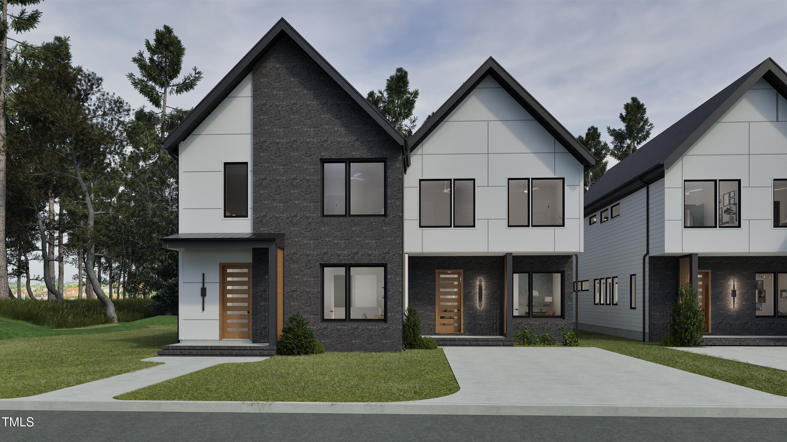 a front view of a house with a yard and trees