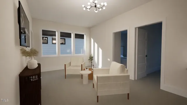 a living room with furniture and a chandelier