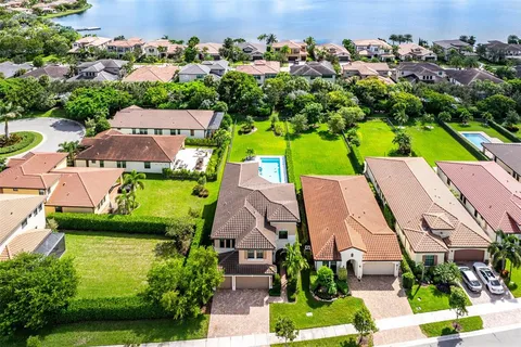 an aerial view of multiple houses with yard