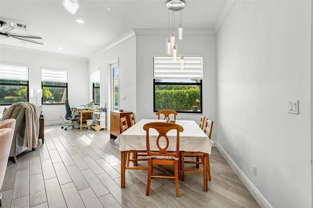 a view of a dining room with furniture window and outside view