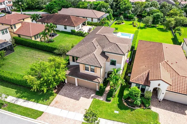 an aerial view of a house with a garden and plants