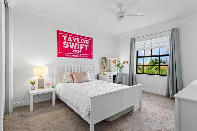 a bedroom with a bed and a table in it