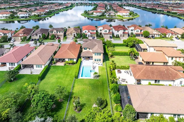 an aerial view of multiple houses with yard