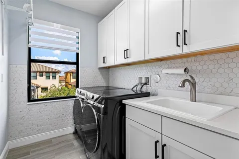a view of a sink and cabinets