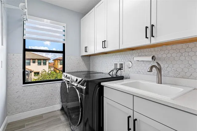 a view of a sink and cabinets