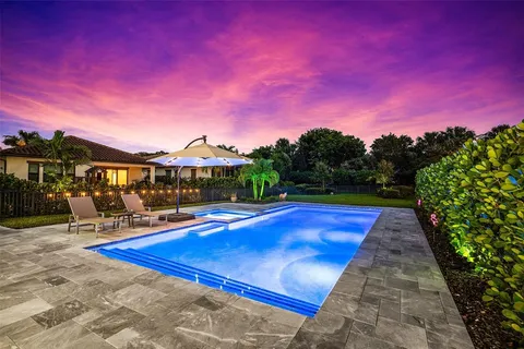 a front view of a building with swimming pool