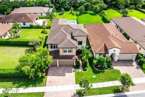 an aerial view of a house with a lake view
