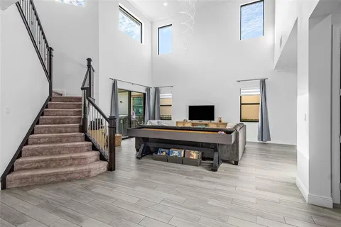 a view of entryway livingroom and hall with wooden floor