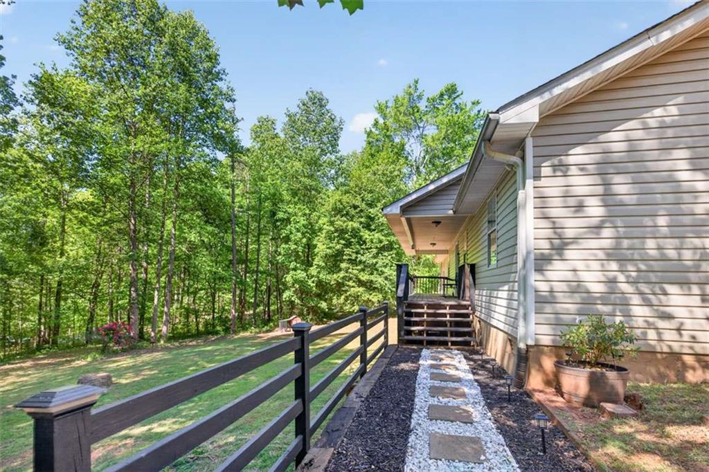 386 Ridgewood Drive Pendergrass, GA 30567 - Photo 5 of 50 a view of a pathway of a house