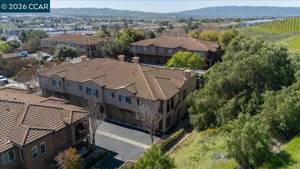 an aerial view of a house with a lake view