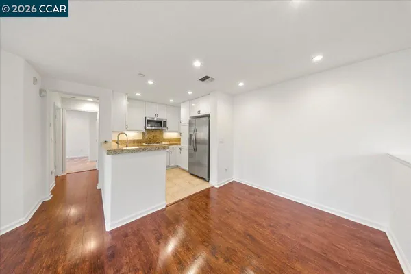a view of kitchen with wooden floor
