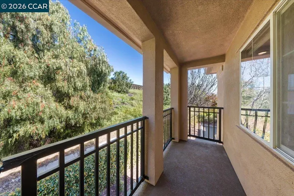 a view of a balcony with an outdoor space