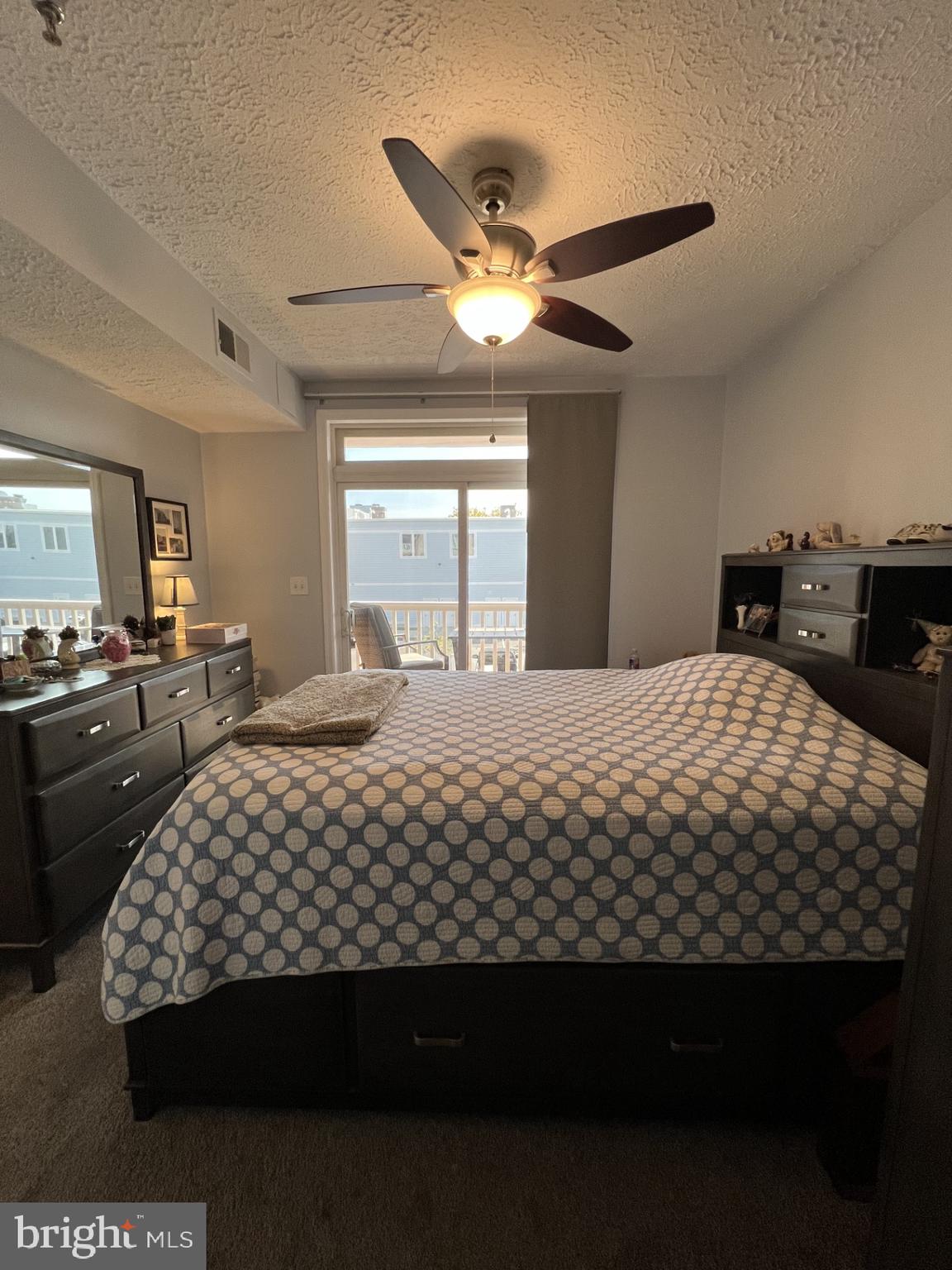 100 Taylor Street, Unit 206 Colonial Beach, VA 22443 - Photo 13 of 26 a bedroom with a bed and a large mirror