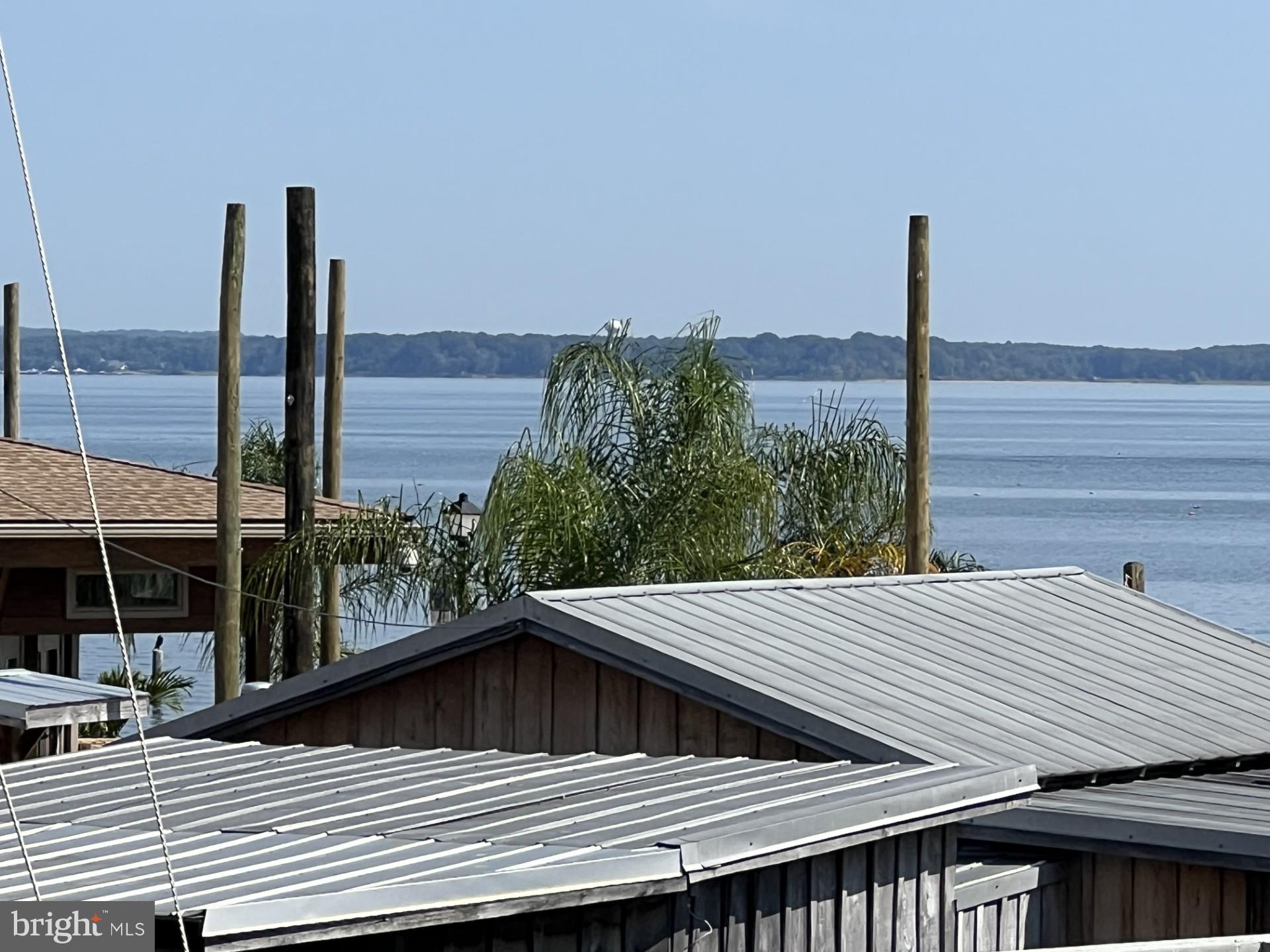 100 Taylor Street, Unit 206 Colonial Beach, VA 22443 - Photo 18 of 26 a view of balcony with wooden floor and city view