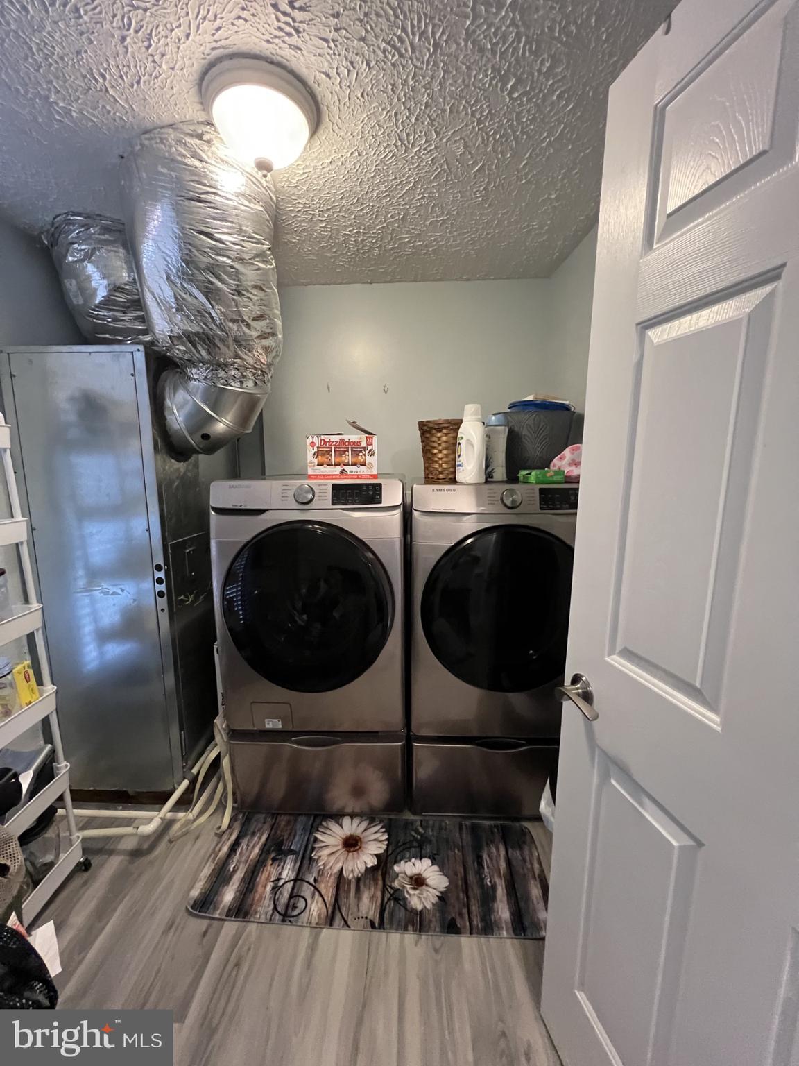 100 Taylor Street, Unit 206 Colonial Beach, VA 22443 - Photo 19 of 26 a room with chairs washer and dryer