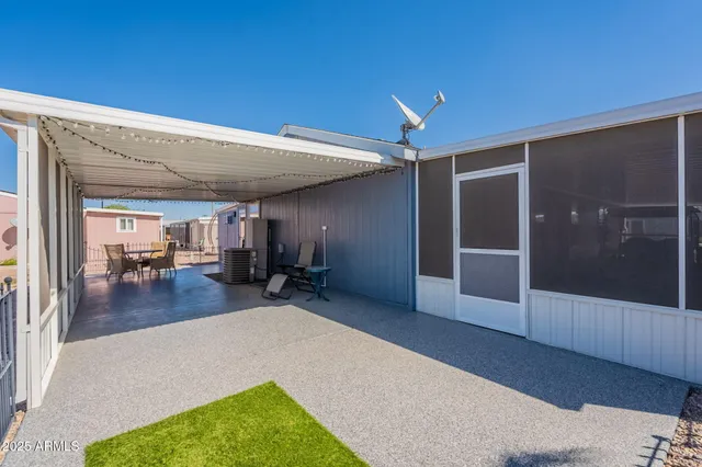 a view of a livingroom with furniture and hardwood floor