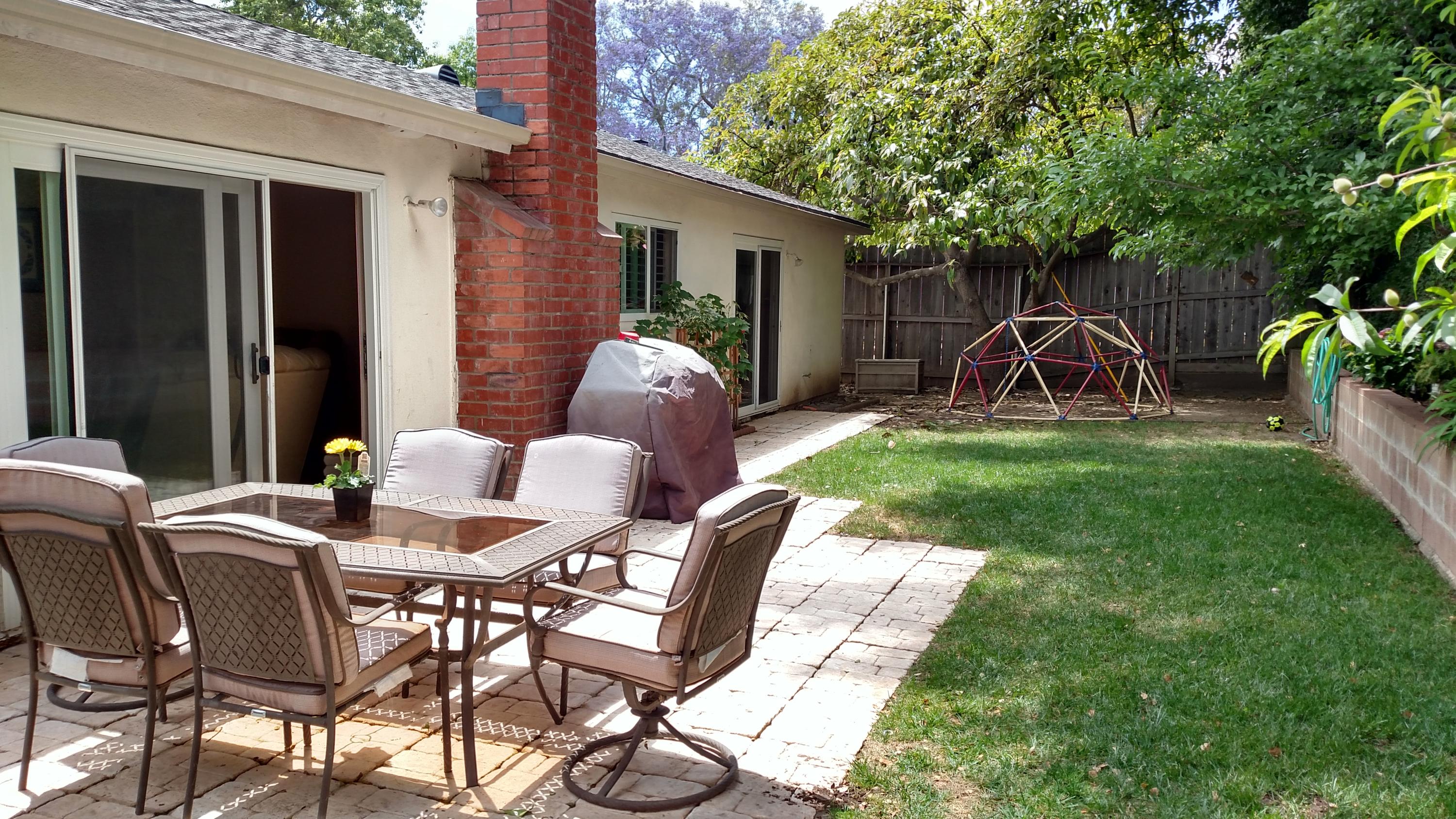 537 Windsor Avenue Goleta, CA 93117 - Photo 16 of 16 a backyard of a house with table and chairs