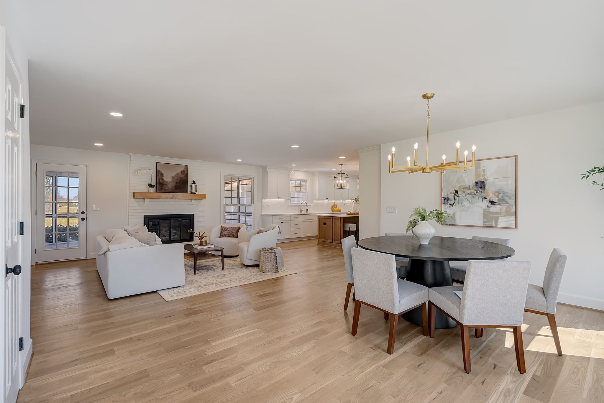 a view of kitchen with furniture and wooden floor
