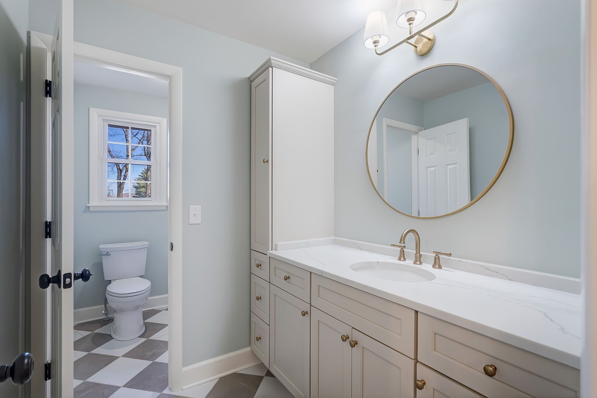 108 Poplar Street Franklin, TN 37064 - Photo 23 of 33 a bathroom with a sink a toilet and a mirror