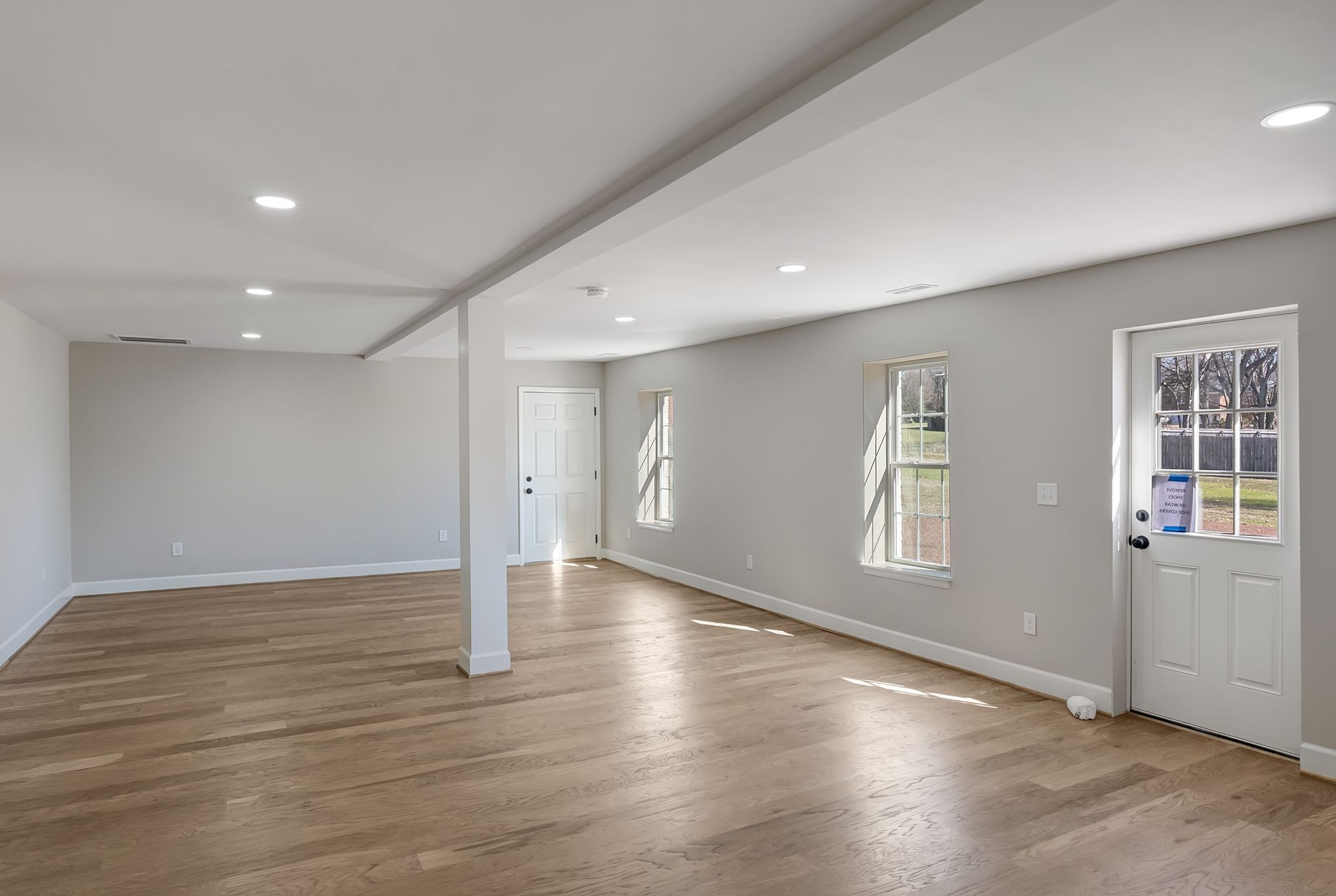 108 Poplar Street Franklin, TN 37064 - Photo 28 of 33 an empty room with wooden floor and windows