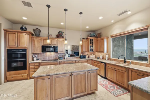 a outdoor dining space with furniture and outdoor view