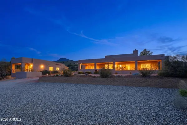 an aerial view of a house with a big yard