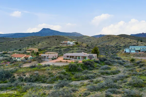 a view of a terrace with a garden and mountain view