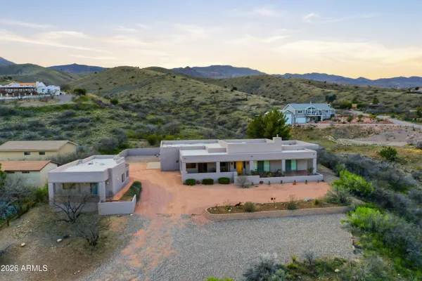 a large bathroom with a glass door shower a sink and a mirror