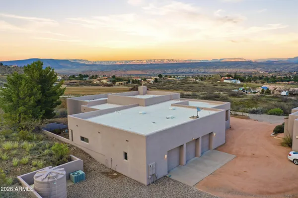a bedroom with a bed and a mirror