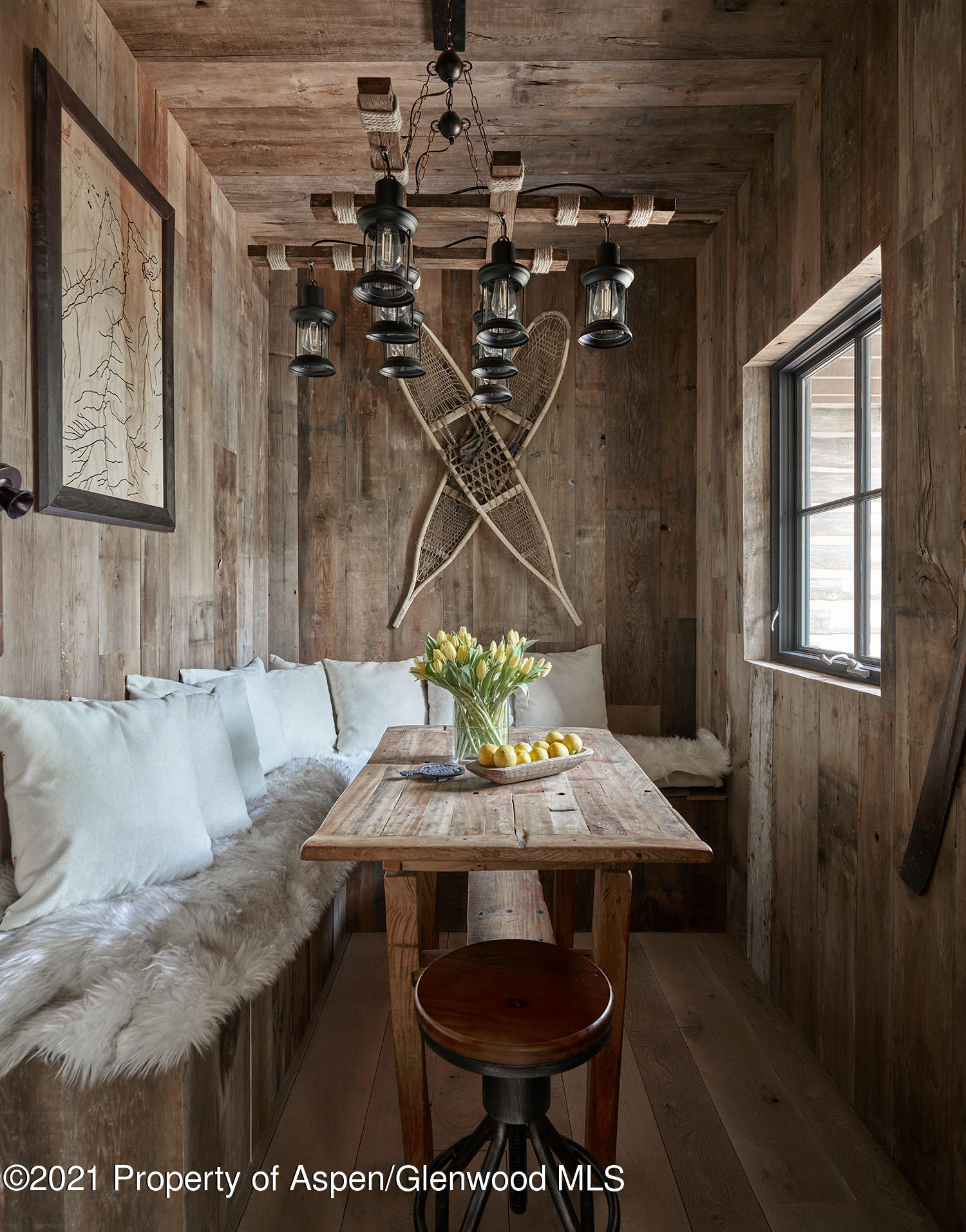 931 North Hayden Road Aspen, CO 81611 - Photo 11 of 44 a view of a dining room with furniture and wooden floor