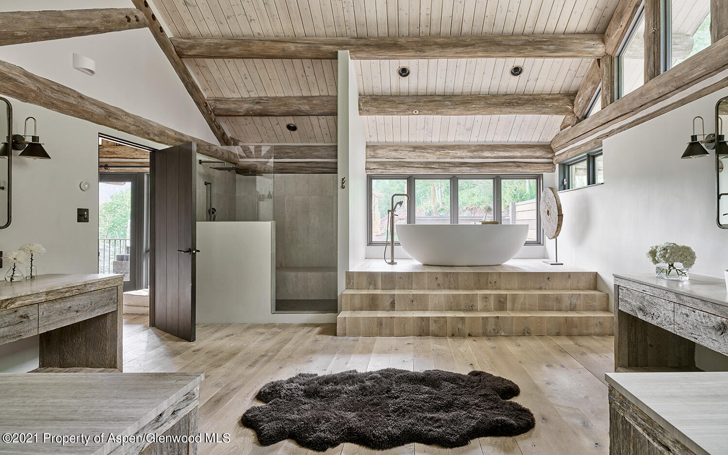 931 North Hayden Road Aspen, CO 81611 - Photo 14 of 44 a living room with a fireplace and a chandelier