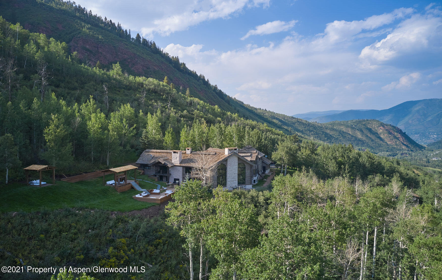 931 North Hayden Road Aspen, CO 81611 - Photo 22 of 44 a view of a big house with a big yard