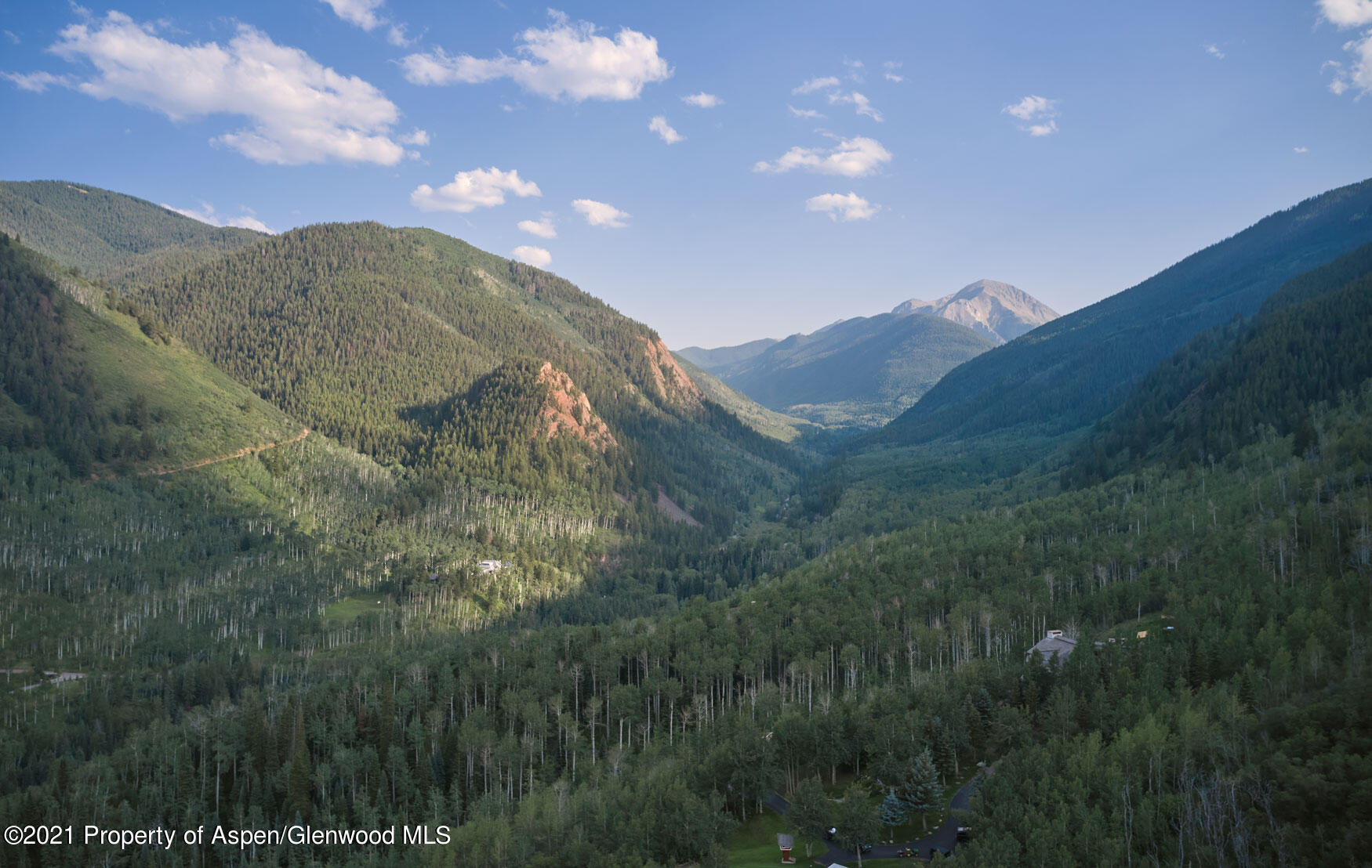 931 North Hayden Road Aspen, CO 81611 - Photo 23 of 44 a view of a house with a mountain in the background