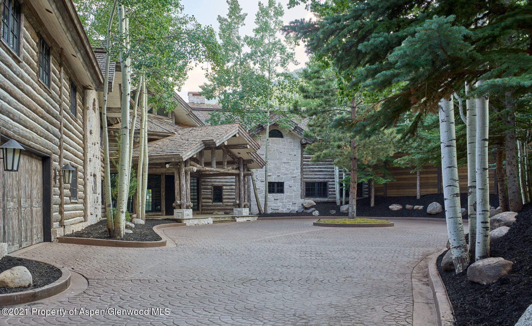 931 North Hayden Road Aspen, CO 81611 - Photo 29 of 44 a view of a house with backyard and porch