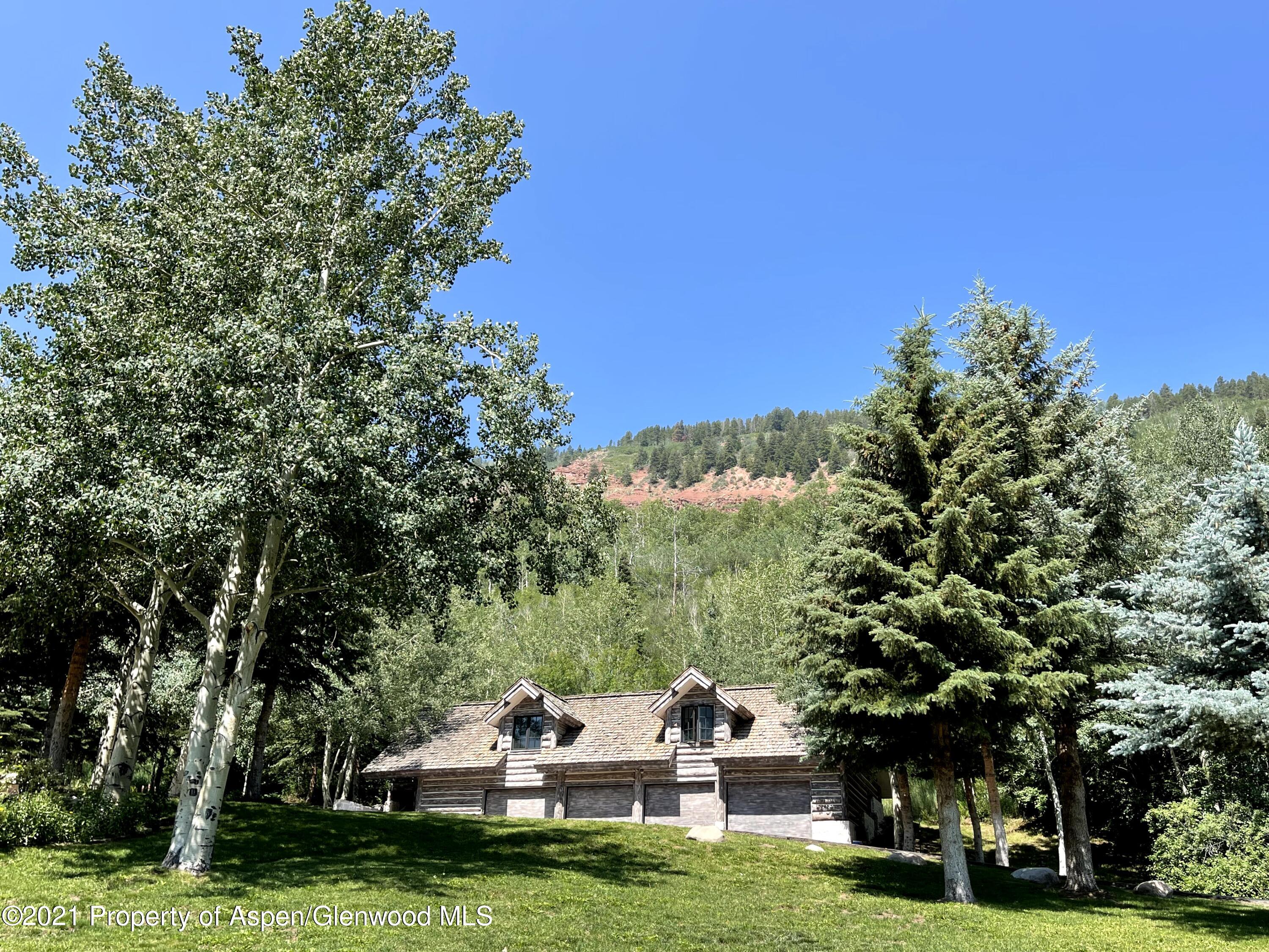 931 North Hayden Road Aspen, CO 81611 - Photo 33 of 44 a backyard of a house with lots of green space