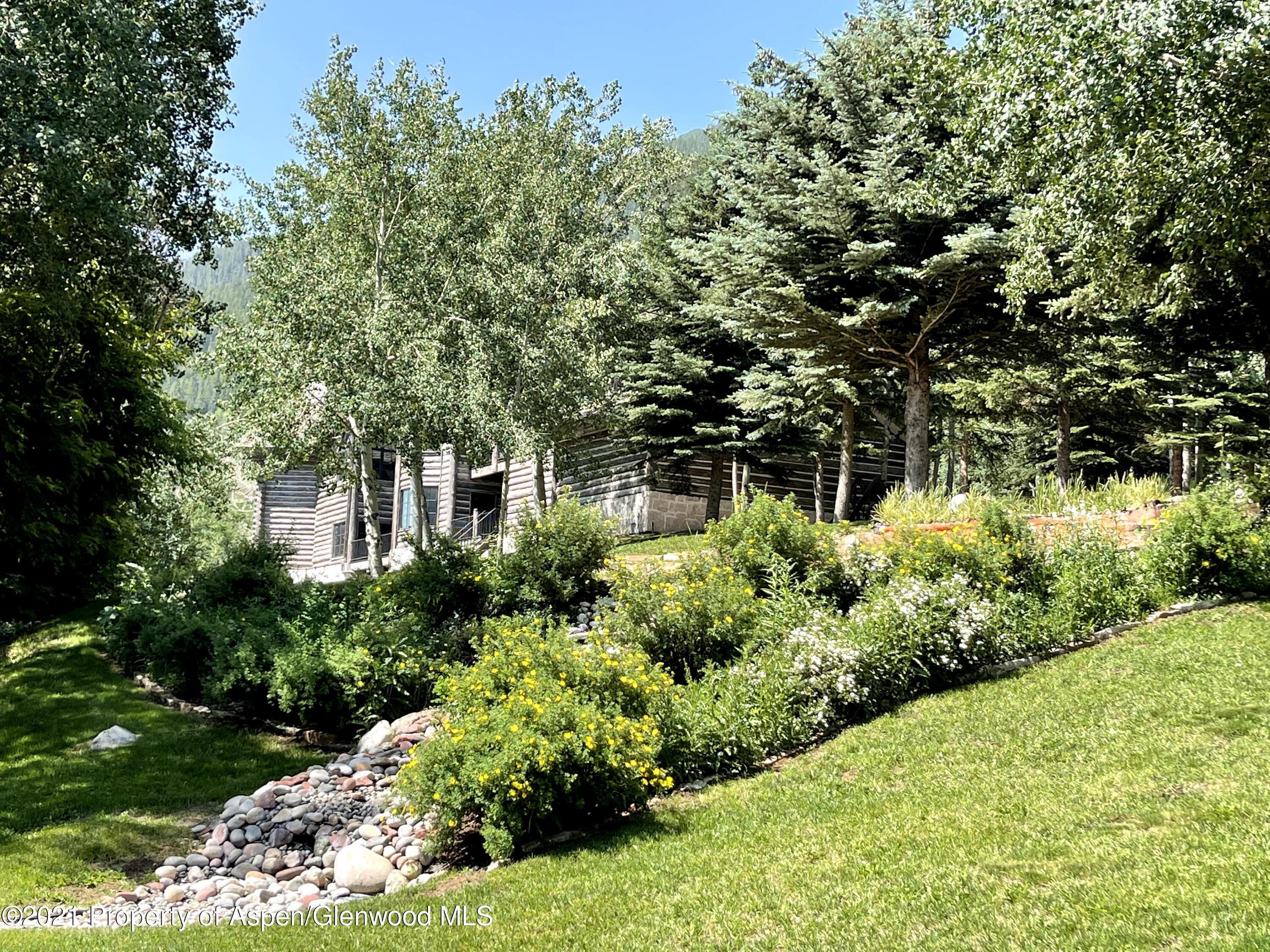 931 North Hayden Road Aspen, CO 81611 - Photo 34 of 44 a front view of a house with a yard