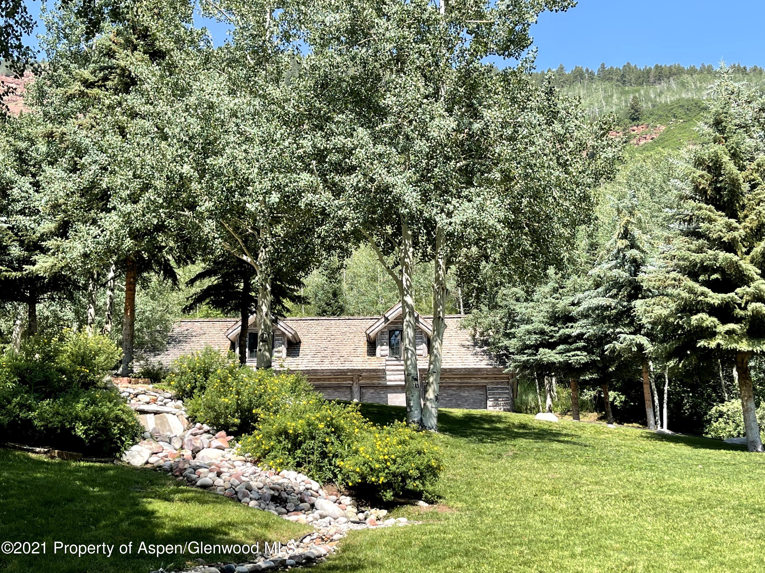 931 North Hayden Road Aspen, CO 81611 - Photo 35 of 44 a front view of a house with a yard