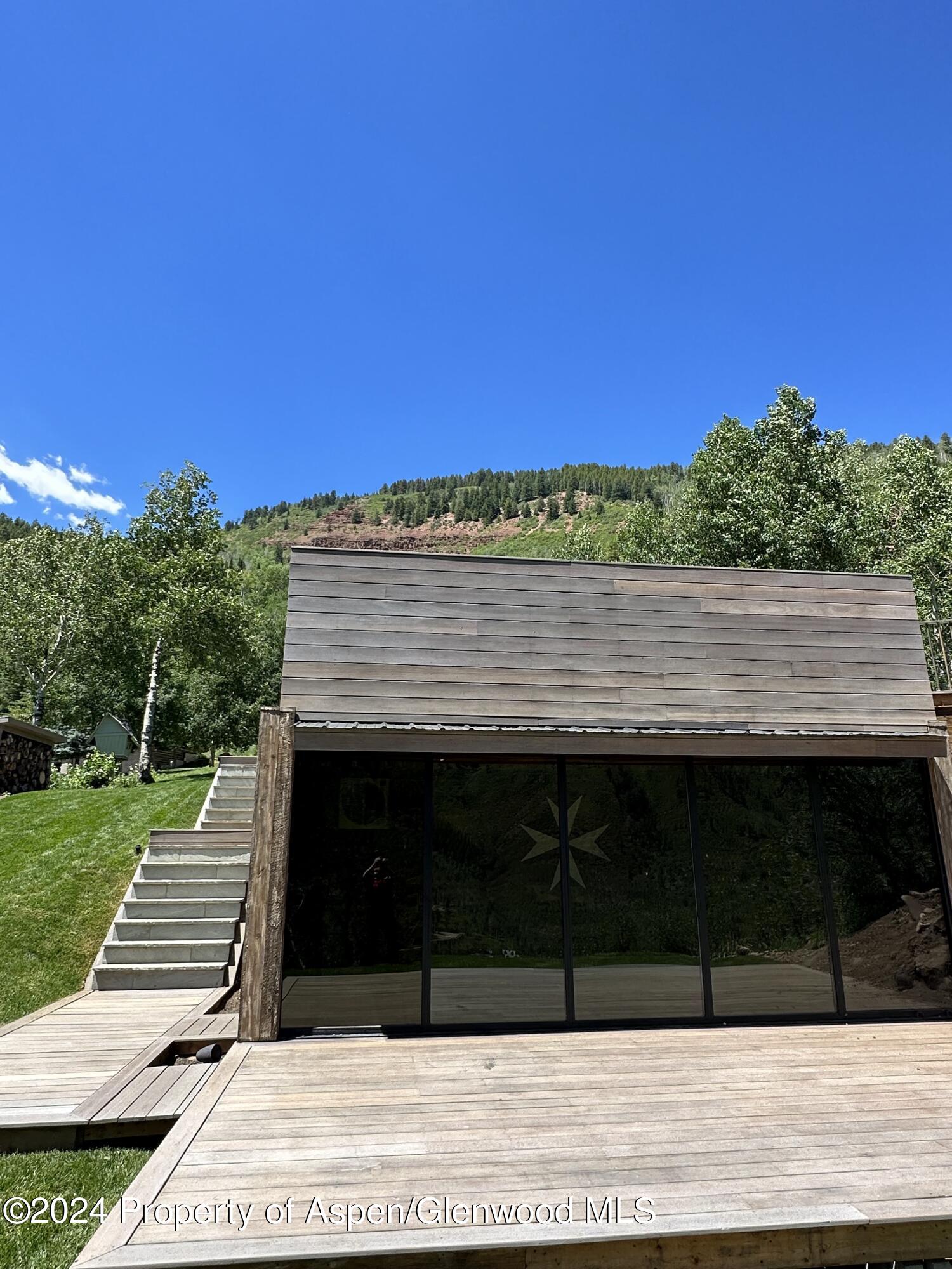 931 North Hayden Road Aspen, CO 81611 - Photo 39 of 44 a view of a wooden floor and a big yard