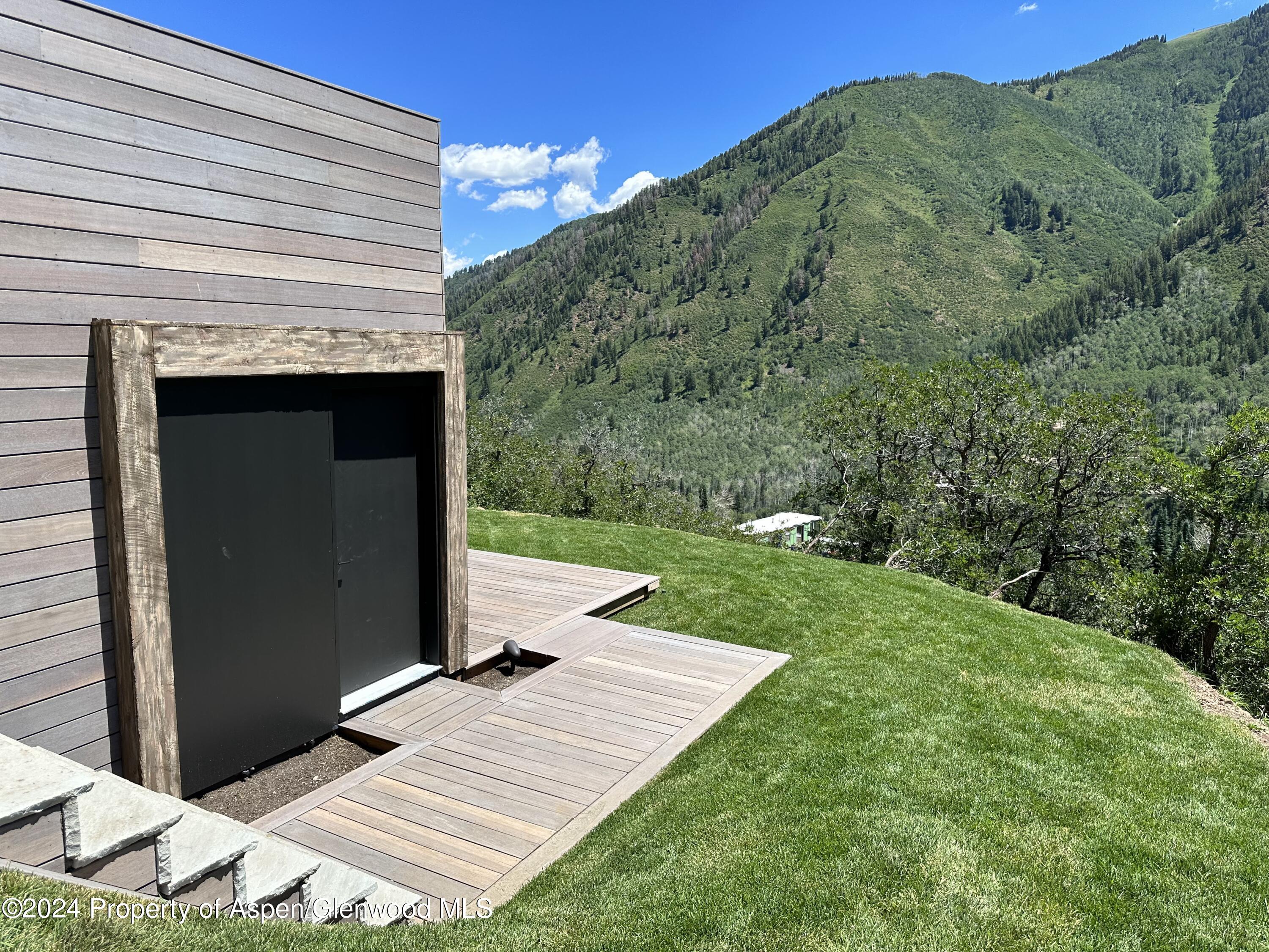 931 North Hayden Road Aspen, CO 81611 - Photo 40 of 44 a view of a terrace with a garden