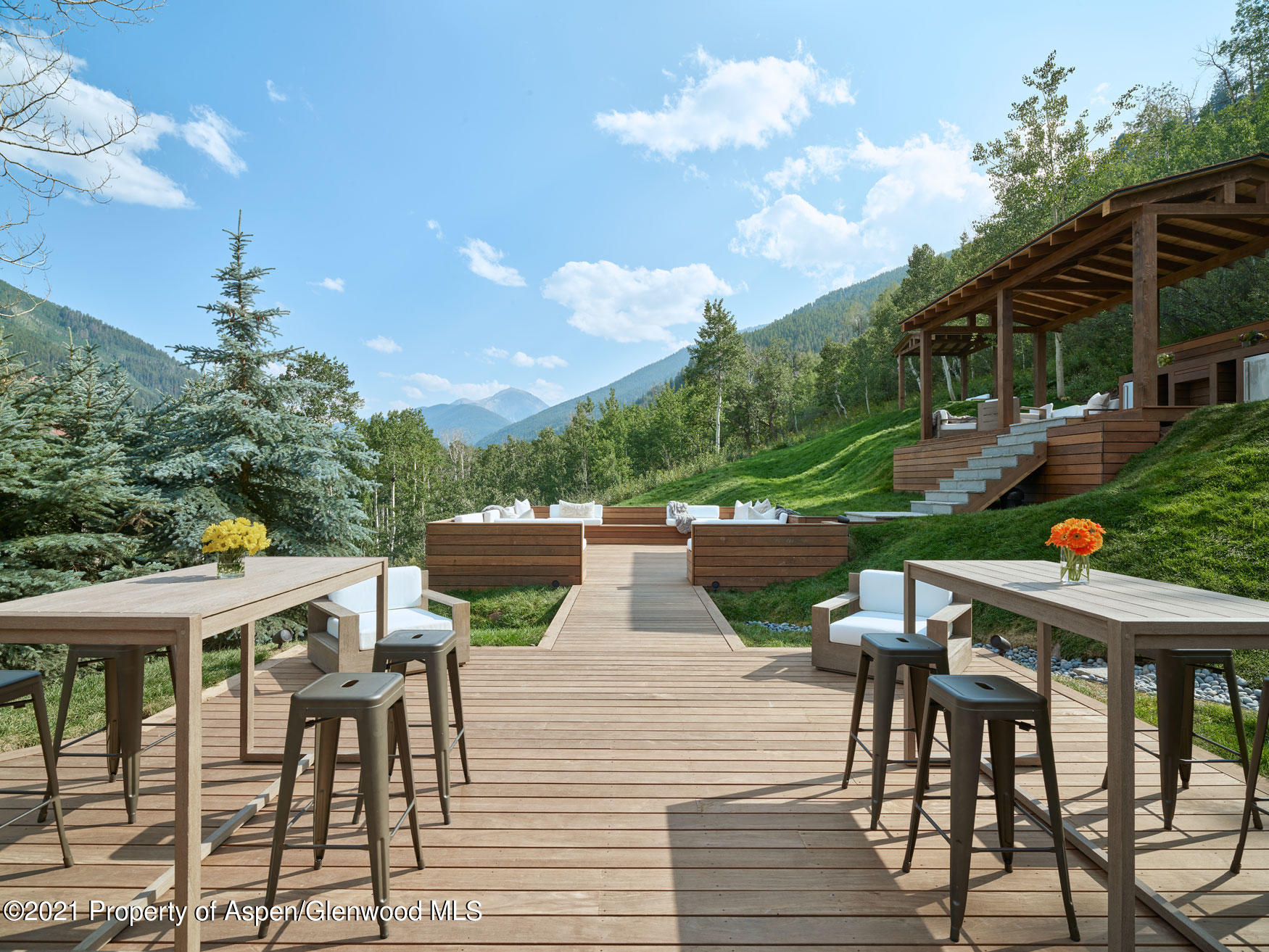 931 North Hayden Road Aspen, CO 81611 - Photo 7 of 44 a view of a patio with table and chairs and potted plants