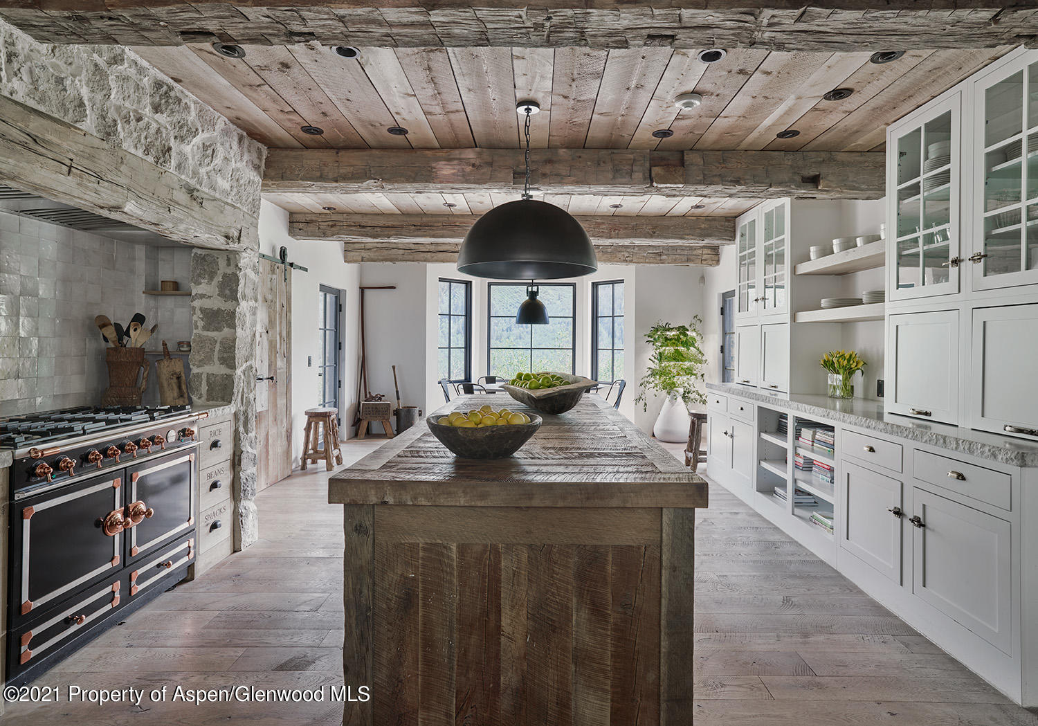 931 North Hayden Road Aspen, CO 81611 - Photo 8 of 44 a kitchen with stainless steel appliances granite countertop a sink a stove and a wooden floors