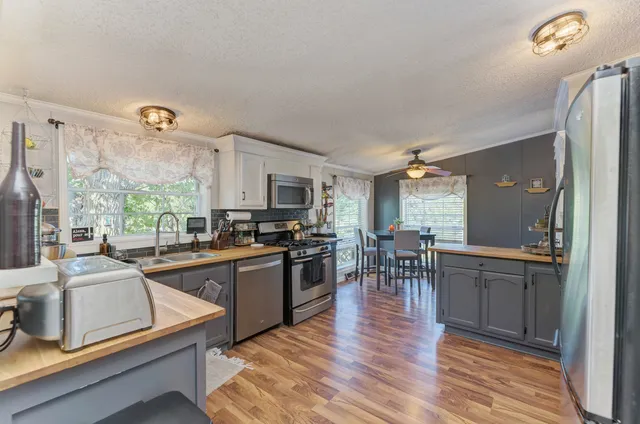 a kitchen with lots of counter top space and dining table